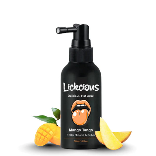Black bottle labeled 'Lickcious' with mango slices and leaves on a white background
